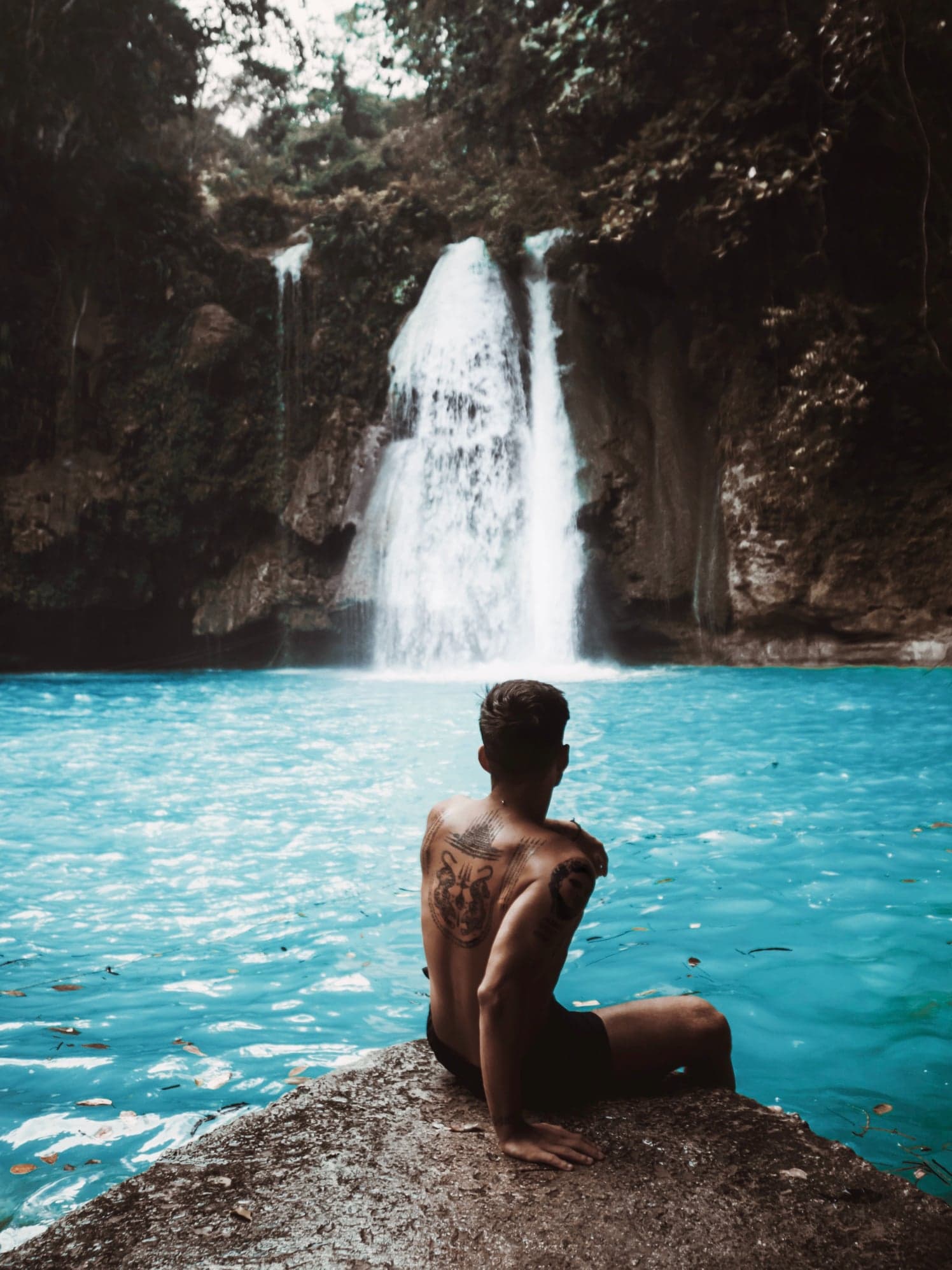 man-facing-waterfalls